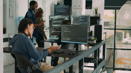 Software programer typing source code on computer keyboard