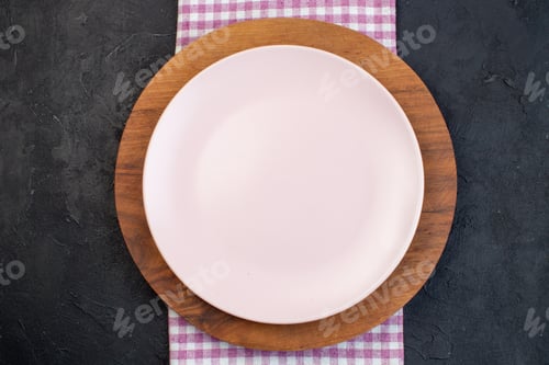 Preview: Close up view of white and brown ceramic empty plates on black background with free space