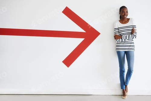 Preview: This way to success. A big red arrow pointing to a stylish woman standing and smiling.