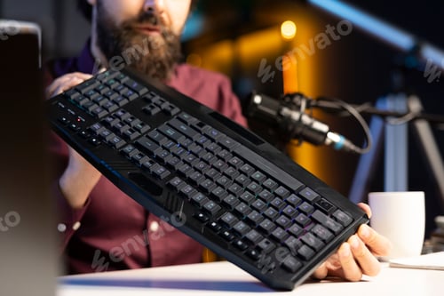 Preview: Close up shot of gaming keyboard reviewed by influencer in studio