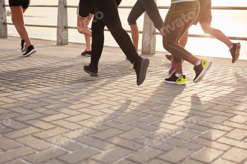 Preview: Runners training together on seaside promenade