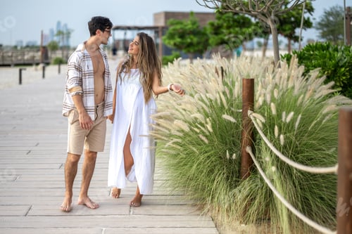 Preview: Beautiful young pregnant woman holding hands with husband, talking about future life with baby