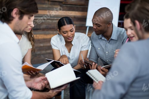 Preview: Business executives discussing during meeting
