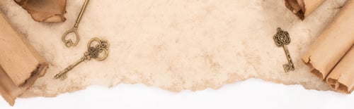 Preview: top view of vintage keys on aged paper isolated on white, panoramic shot