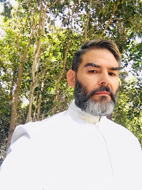 Preview: Strict handsome middle aged man in white uniform