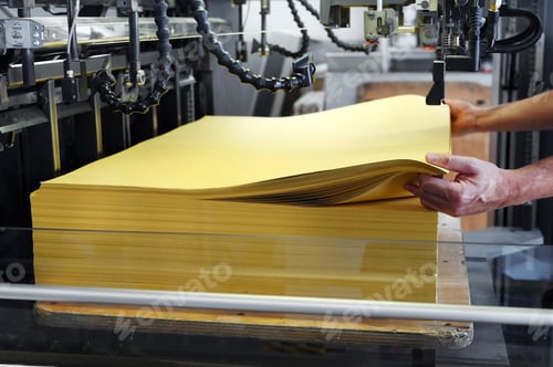 Preview: Crop worker loading paper into printer