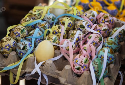 Preview: Vienna, Austria-April,2 Colorful painted easter eggs in basket at the traditional European market