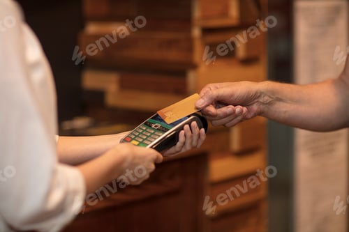 Preview: Cropped view of customer making contactless payment
