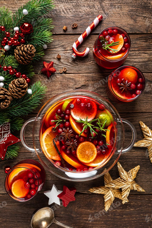 Preview: Christmas punch. Festive red hot toddy cocktail, drink with cranberries and citrus fruits