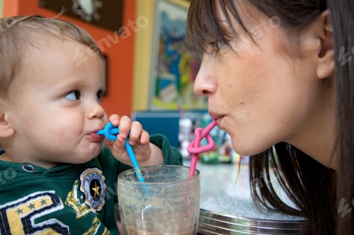 Preview: Mother and baby son using curly straws