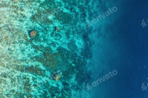 Preview: Ocean as a background from top view. Turquoise water background from top view.