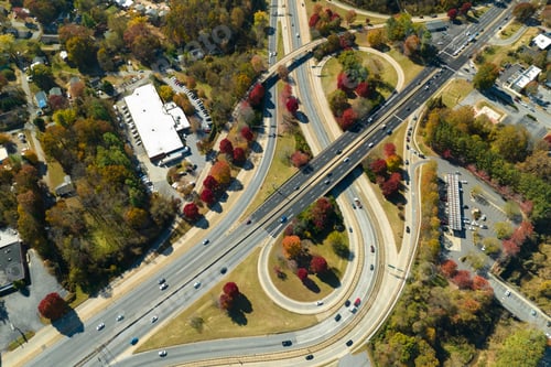 Preview: American freeway intersection with fast driving cars and trucks.