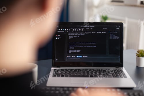 Preview: Freelancer writing code on laptop using keyboard