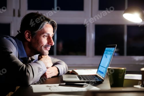 Preview: Man working late in office