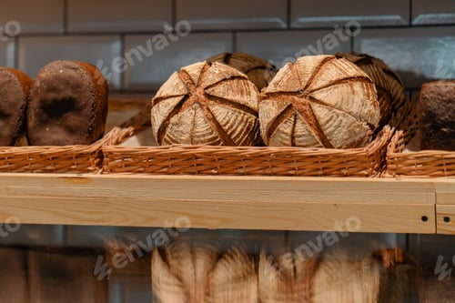 Preview: Freshly baked bread laid out in baskets on bakery counter