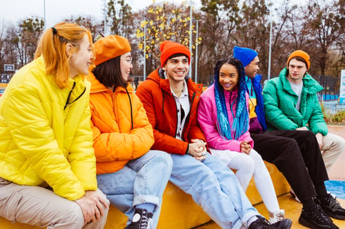 Preview: Multiracial group of young friends meeting outdoors in winter