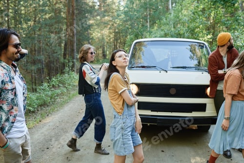 Preview: Young people walking in the forest