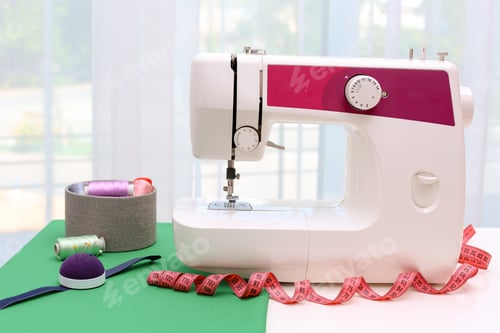 Preview: Modern sewing machine on table near window indoors