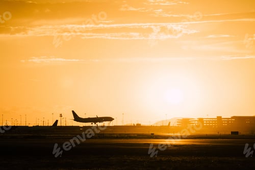 Preview: Commercial plane flying over the airport during sunset in Salt Lake City, Utah
