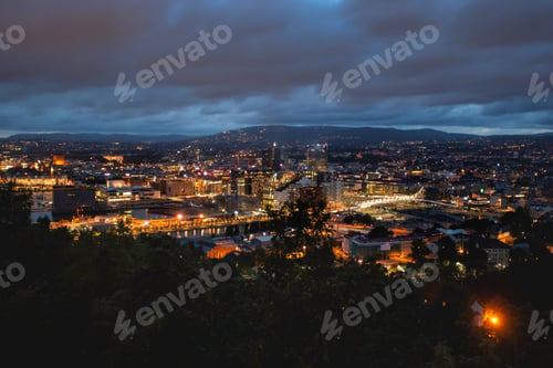 Preview: Night panoramic view of Oslo, capital of Norway. Scandinavian city with lighted buildings.