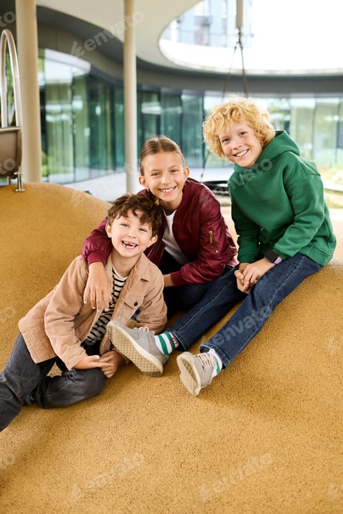 Preview: Joyful friendship and playful moments in autumns golden hues at a playground