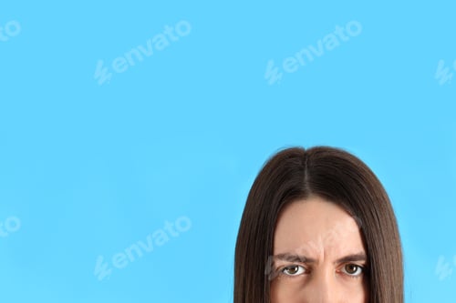 Preview: Half face of a young girl on a blue background