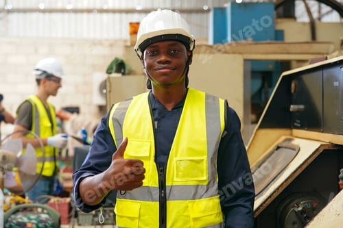 Preview: Robotics engineer working on maintenance of modern robotic arm in factory warehouse