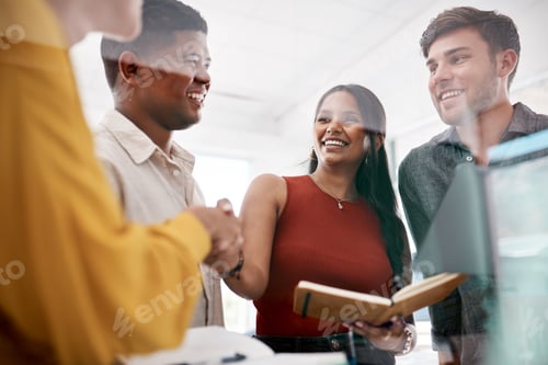Preview: Shot of businesspeople shaking hands during a meeting in an office
