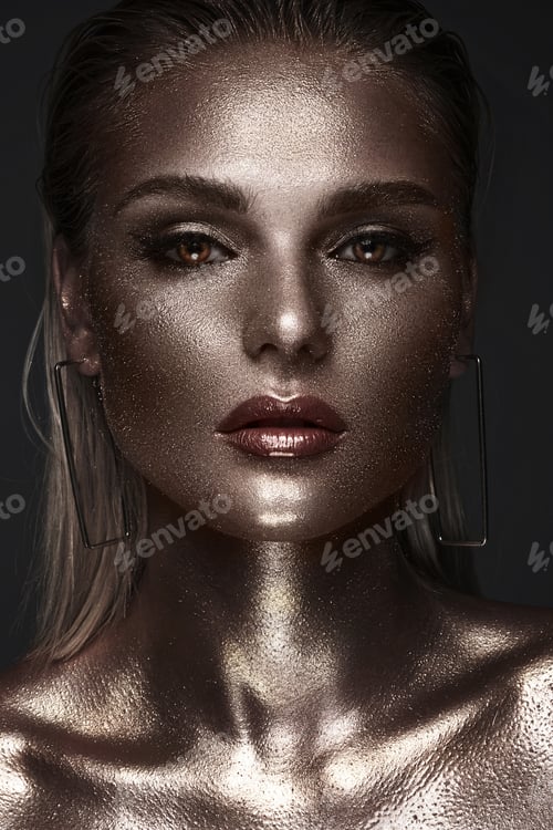 Preview: Portrait of beautiful woman with art space makeup on her face and body. Glitter Face.
