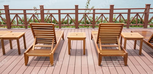 Preview: Row Of Chaise Lounges With Handrail In Park By The Sea