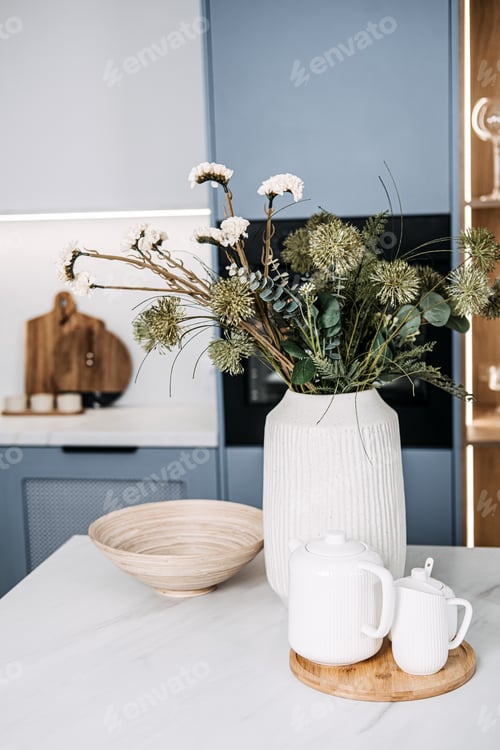 Preview: Design Trends in Ceramic decor. Modern Kitchen Interior with Elegant Decor. Stylish white ceramic