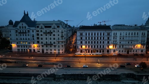 Preview: Aerial view of Budapest Tram passing through city neighbourhood during blue hour