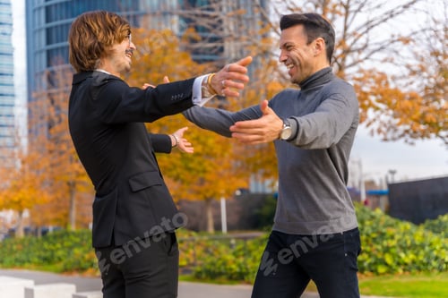 Preview: Caucasian middle aged businessman and executive, colleagues embracing, good work environment
