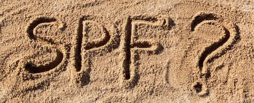Preview: Sun protect factor concept. SPF word written on the beach with question mark