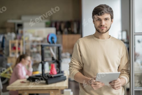 Confident Man Holding Tablet Near 3D Printer