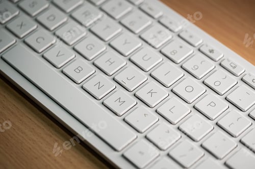 Preview: Computer keyboard and on the desk close up.