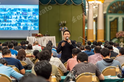 Preview: Asian Speaker with casual suit standing and giving the knowledge with audience in conference hall