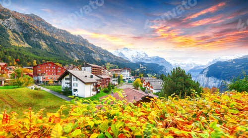 Preview: Stunning autumn view of picturesque alpine village Wengen