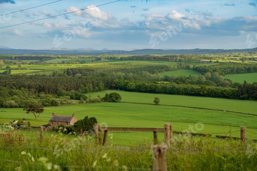 Preview: Aerial view of lush green pastures and fields in the British countryside