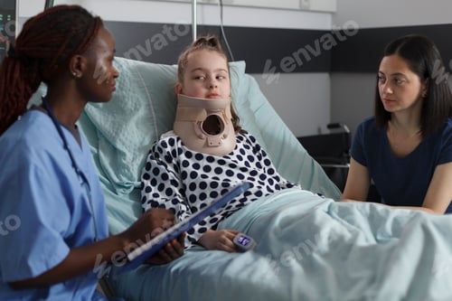 Preview: Nurse examining injured girl with fractured neck wearing cervical collar because of car accident