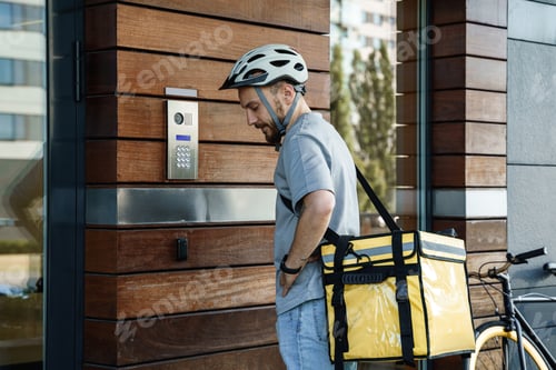 Preview: Express food delivery courier with insulated bag using intercom.
