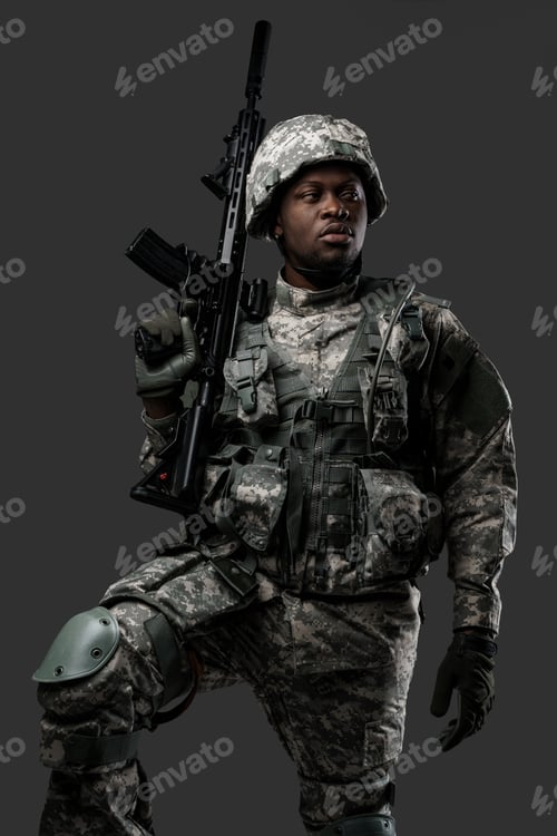 Preview: Courageous black soldier dressed in uniform and holding rifle