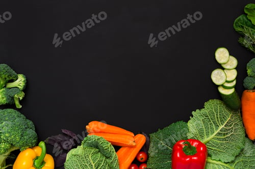 Preview: Border of fresh vegetables on wooden background with copy space