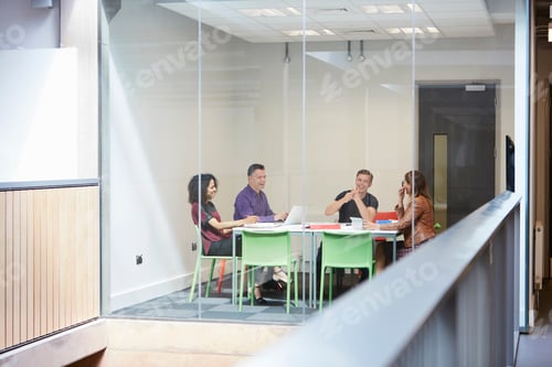 Preview: Design team meeting at design studio boardroom table