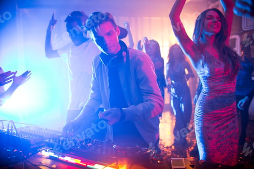 Preview: DJ Playing Music in Nightclub