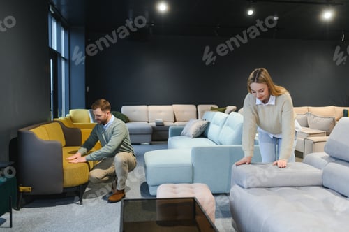 Preview: Happy couple choosing furniture in store