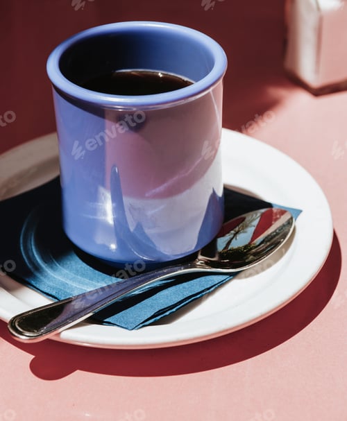 Preview: Coffee in a blue cup on a sunny day