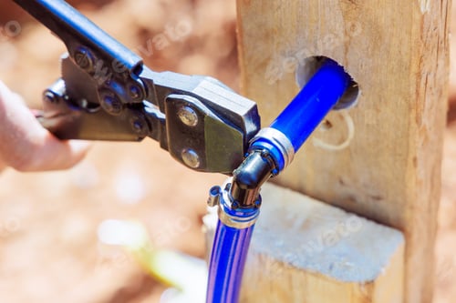 Preview: Blue PVC pipe is connected to water piping system by a plumber