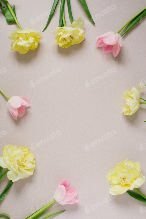 Preview: Bouquet of pink and yellow tulips on a pastel beige background