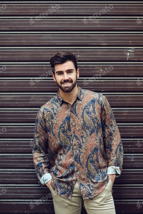 Preview: Young bearded man, model of fashion, wearing shirt in urban back